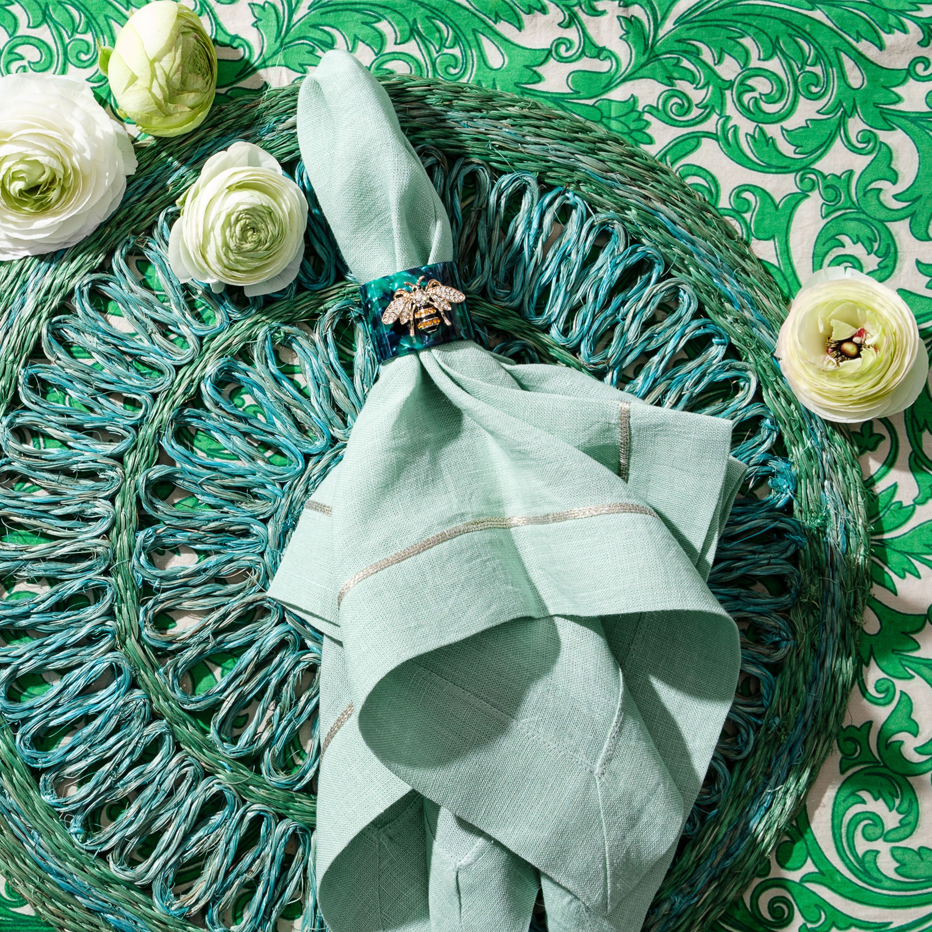 Stripey bee resin napkin rings, green tortoiseshell, set of four