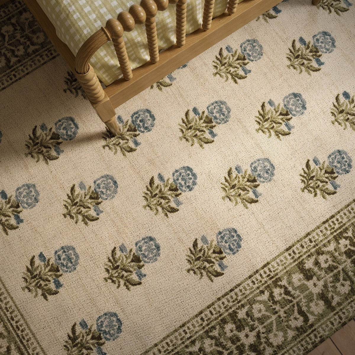 Bibury Dainty Bouquet Rug in Green in a bedroom